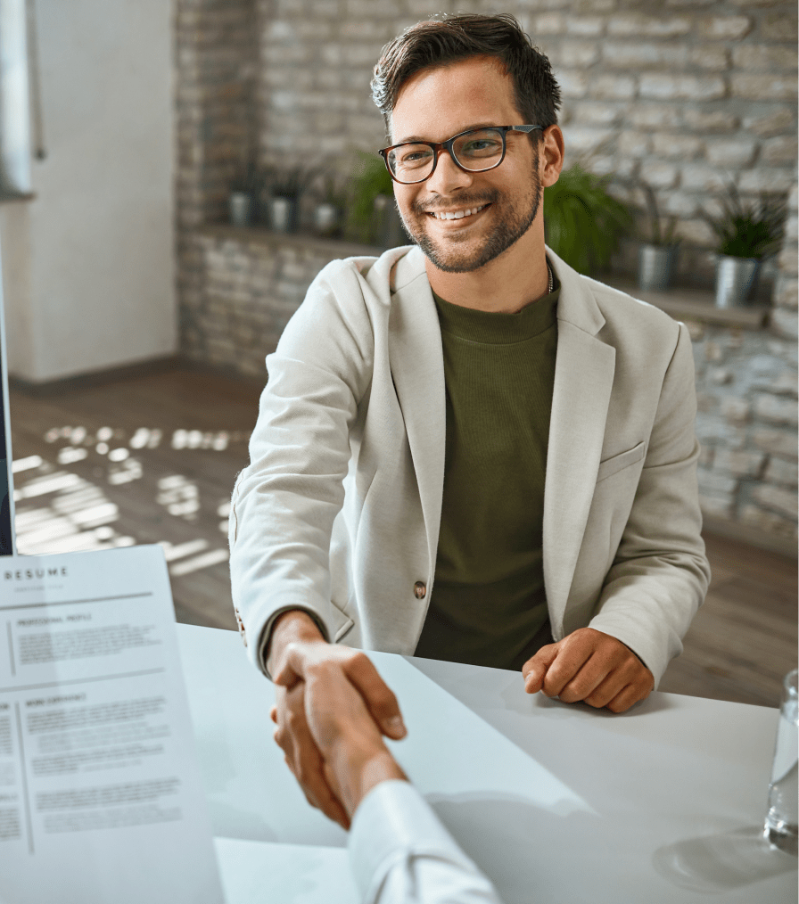 happy-male-candidate-greeting-member-human-resource-team-job-interview-office 1-min